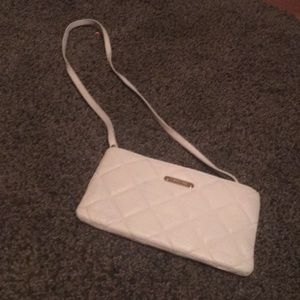 wallet/clutch. Detachable shoulder strap.